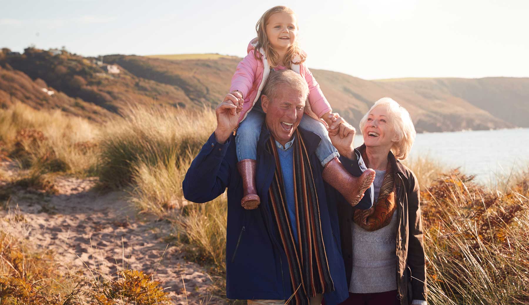 Grandparents out for a walk wth their granddaughter. 